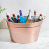 BarCraft Hammered Galvanised Steel Copper Finish Drinks Pail with Background and Bottles