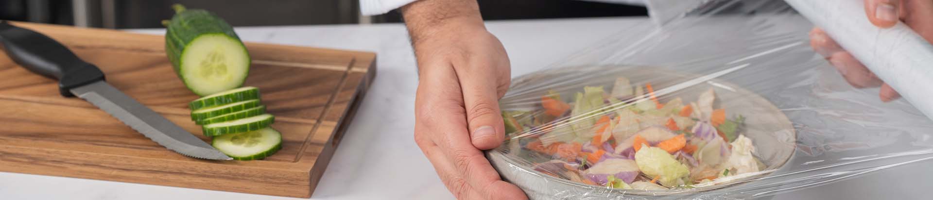 wrapping up a salad with cling film