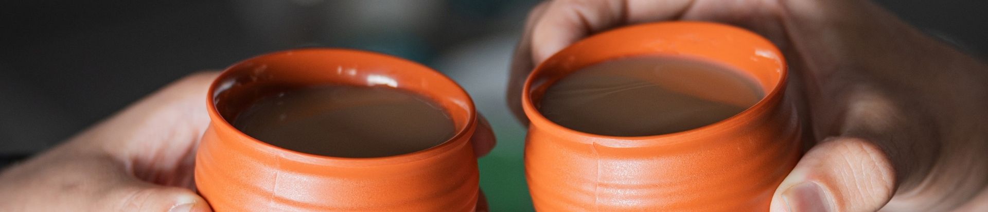 Two people drinking chai