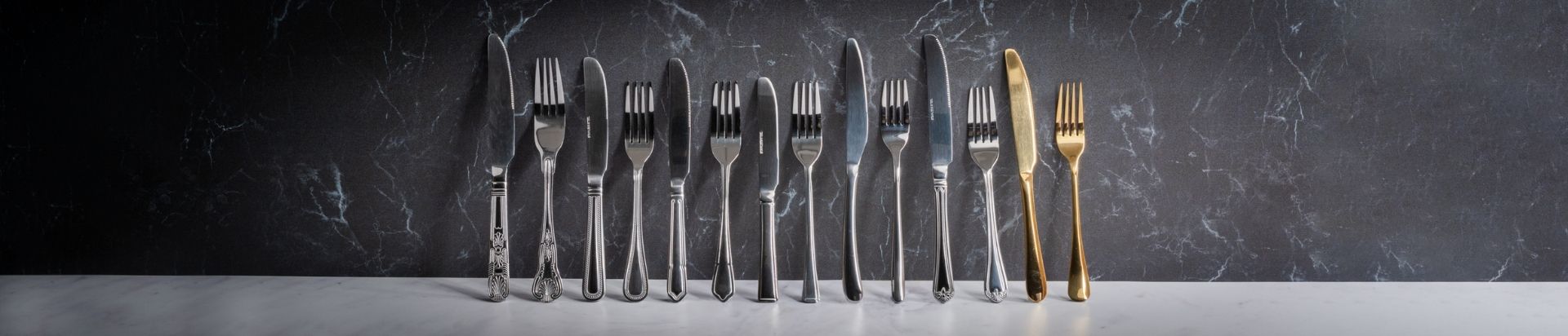 Different ranges of cutlery stood in a line