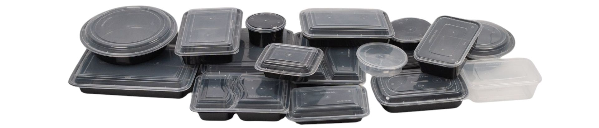 Picture of black take out containers piled up.