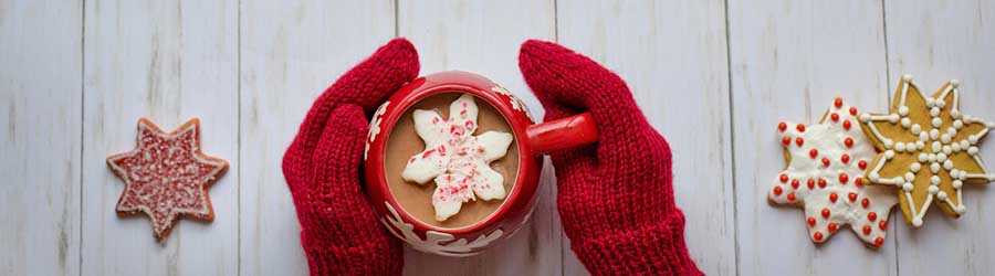 Hands on a mug of hot chocolate