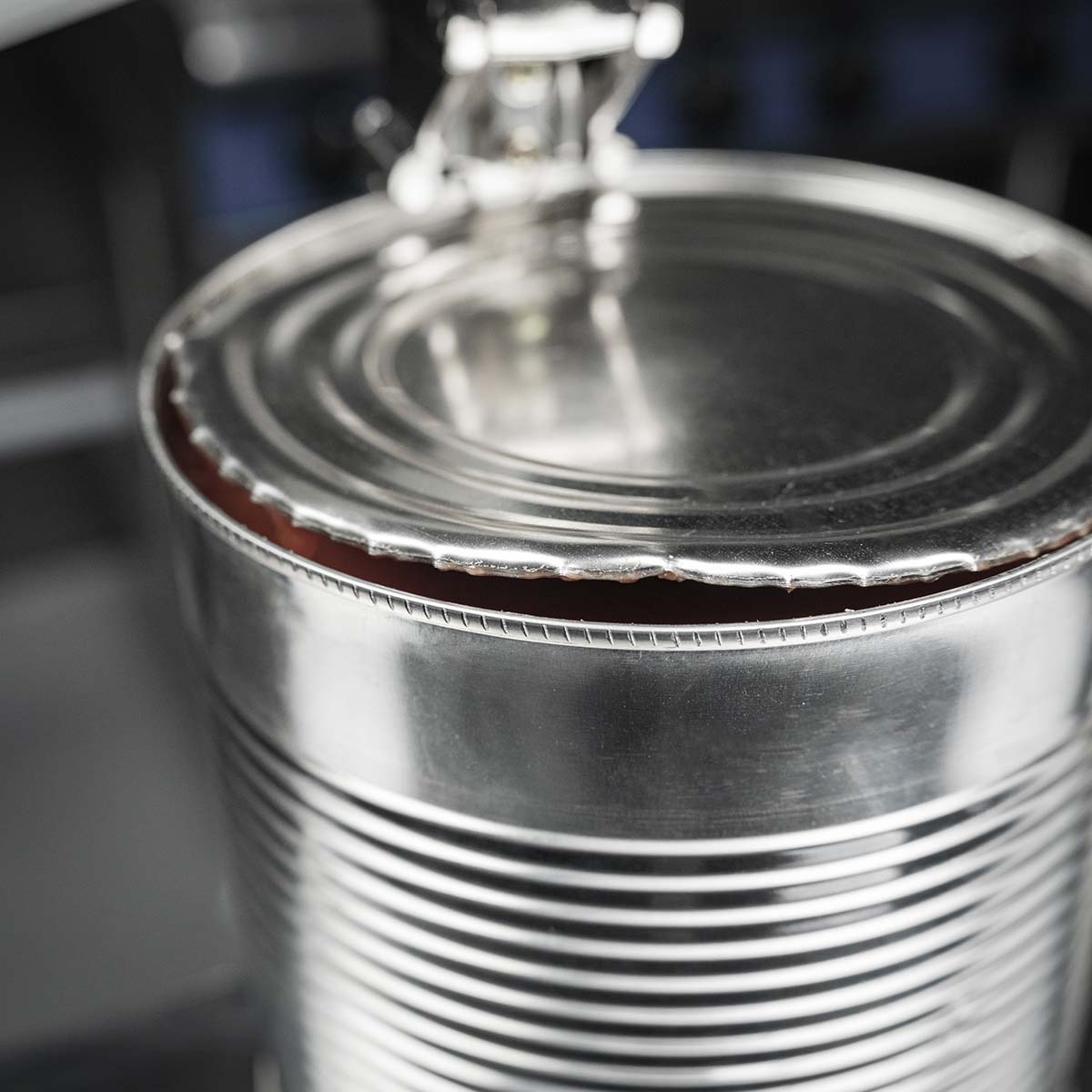 Jagged edges of an opened can of food