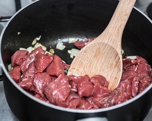 Beef stew in a saucepan