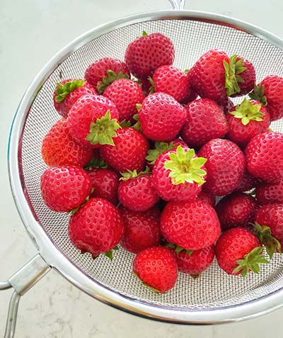 Sieve with fruit in it