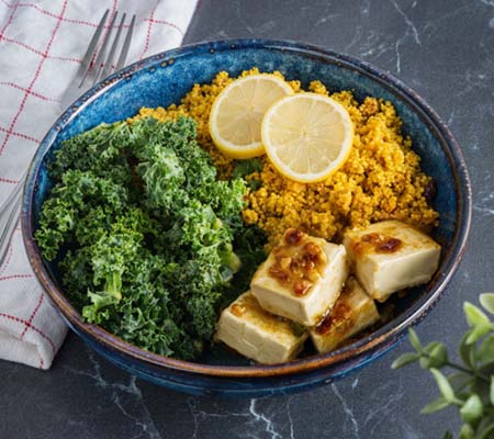 Dish with tofu, greens and grains.