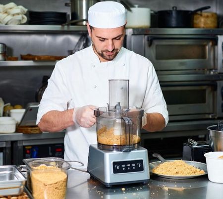 Chef re-using bread to make breadcrumbs