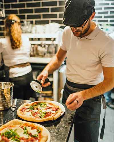 Chef cutting pizza Chef cutting pizza