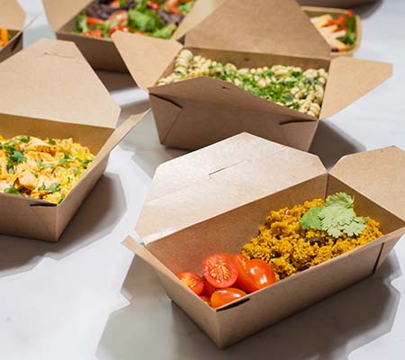 Paper food serving cartons with food