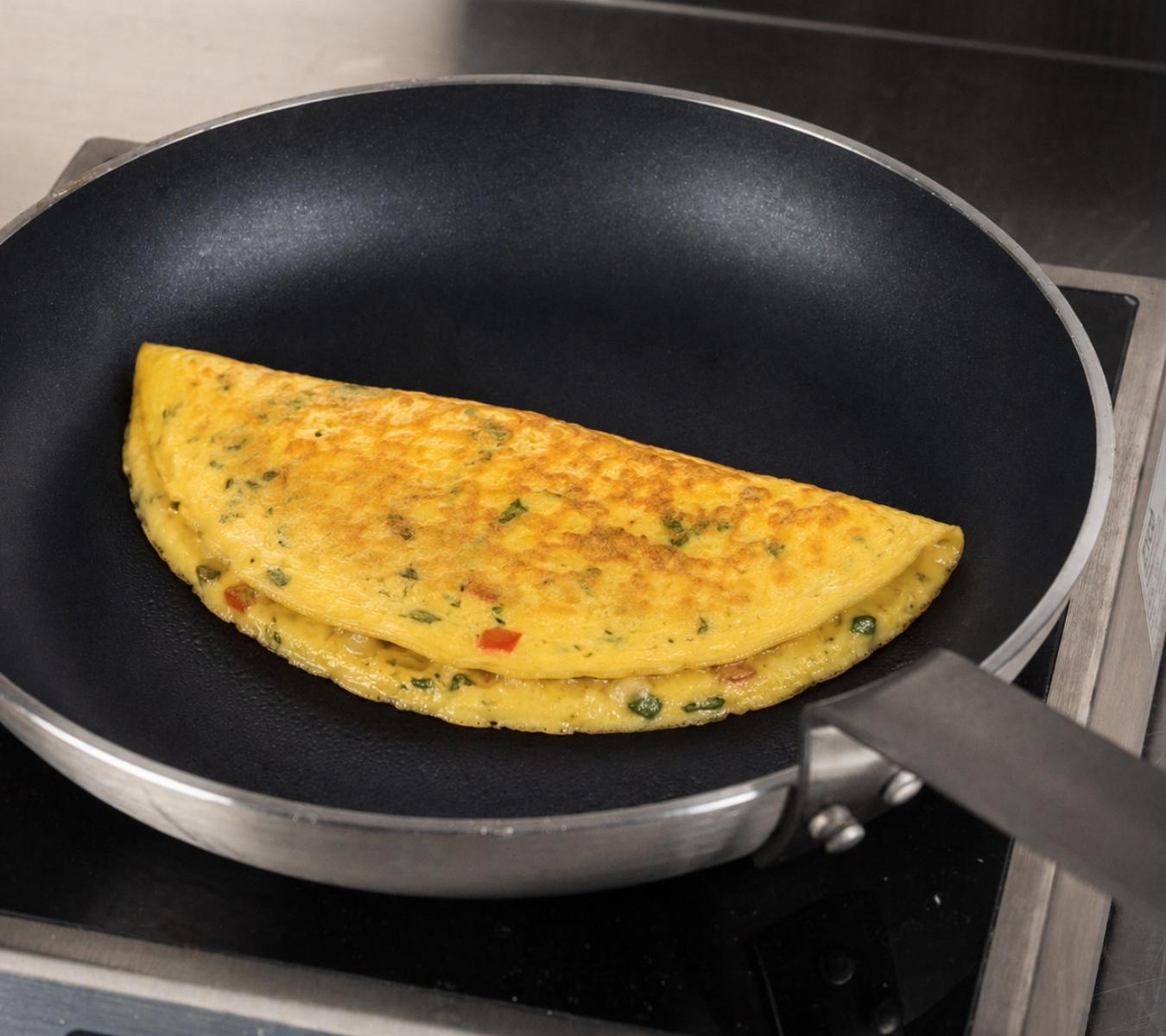 Omelette cooking in a pan