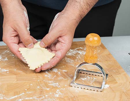 Kitchen gadget in use: Square Ravioli Cutter