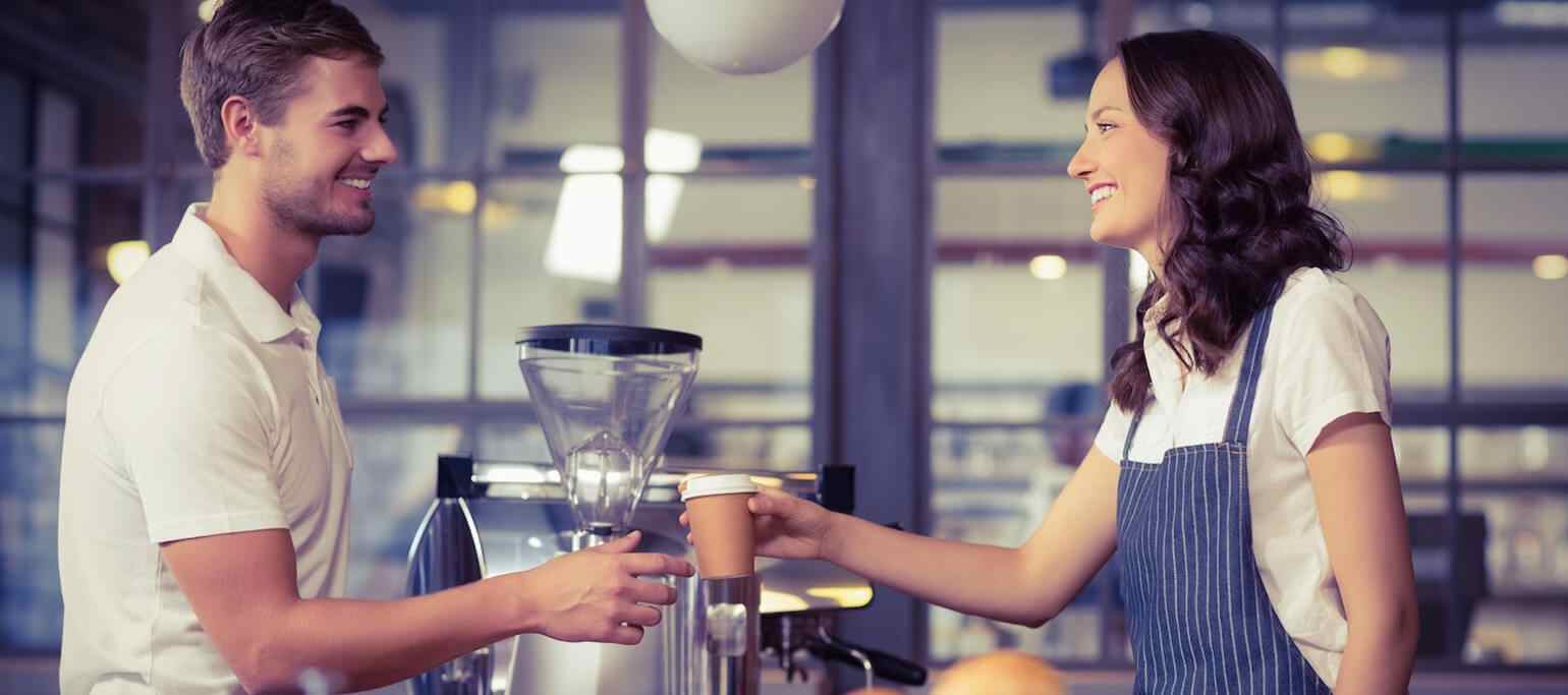 smiling people at a coffee shop