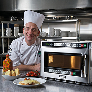 Chef with a commercial microwave