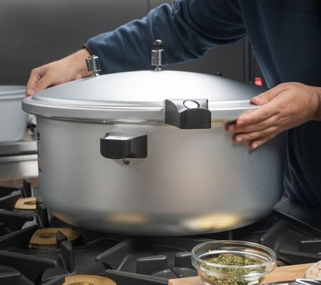 Large pressure cooker on a hob