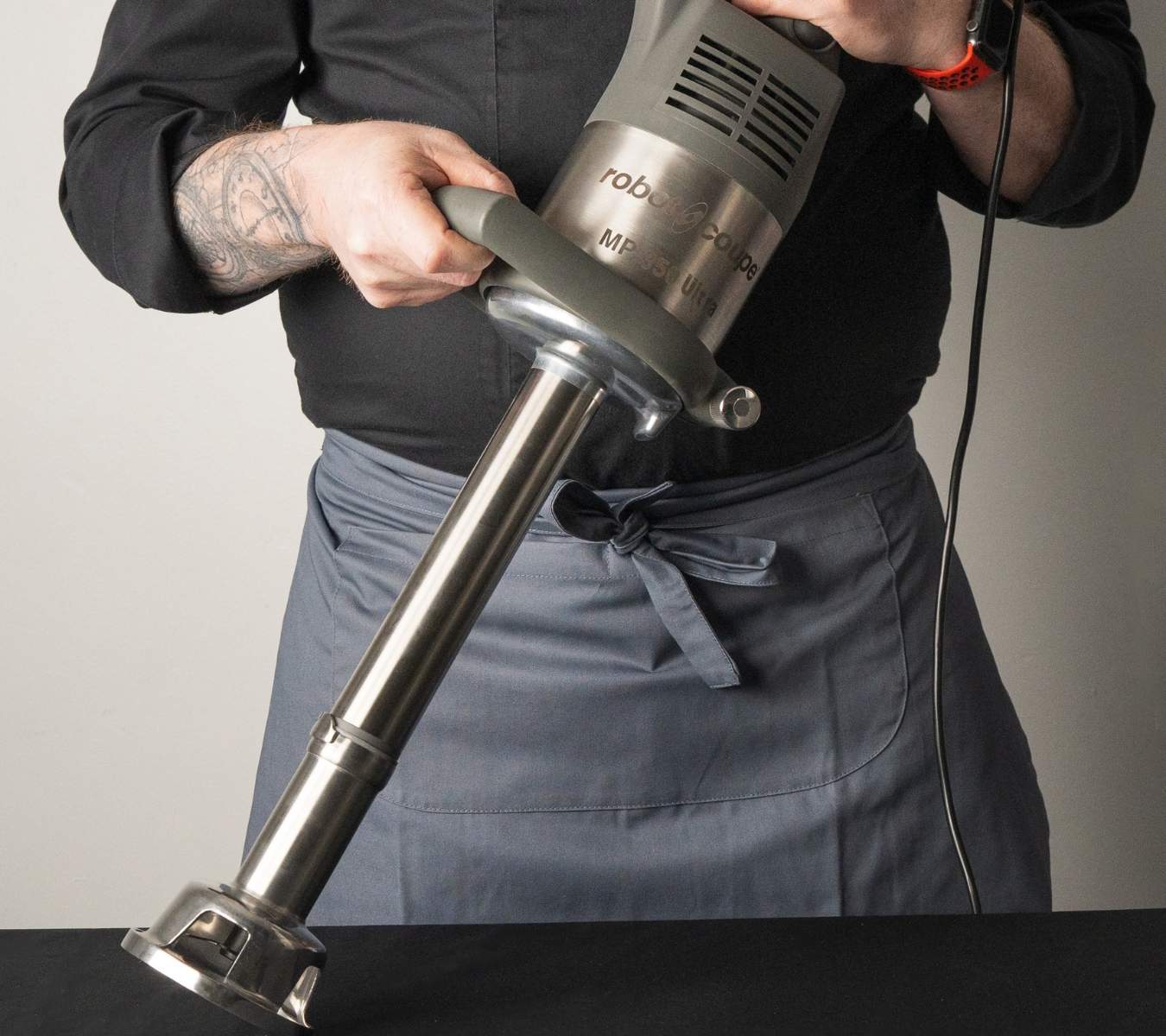 Chef with a Robot Coupe immersion stick blender