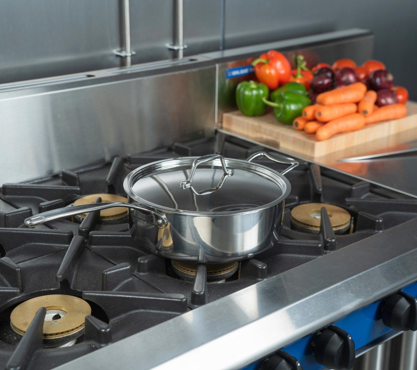 Stainless steel cookware on oven hob