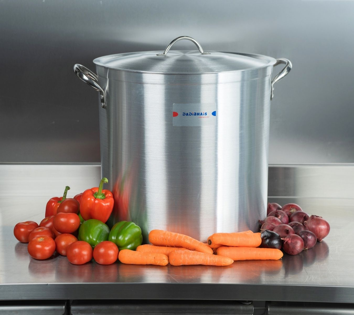 Stock pot pan on counter with vegetables